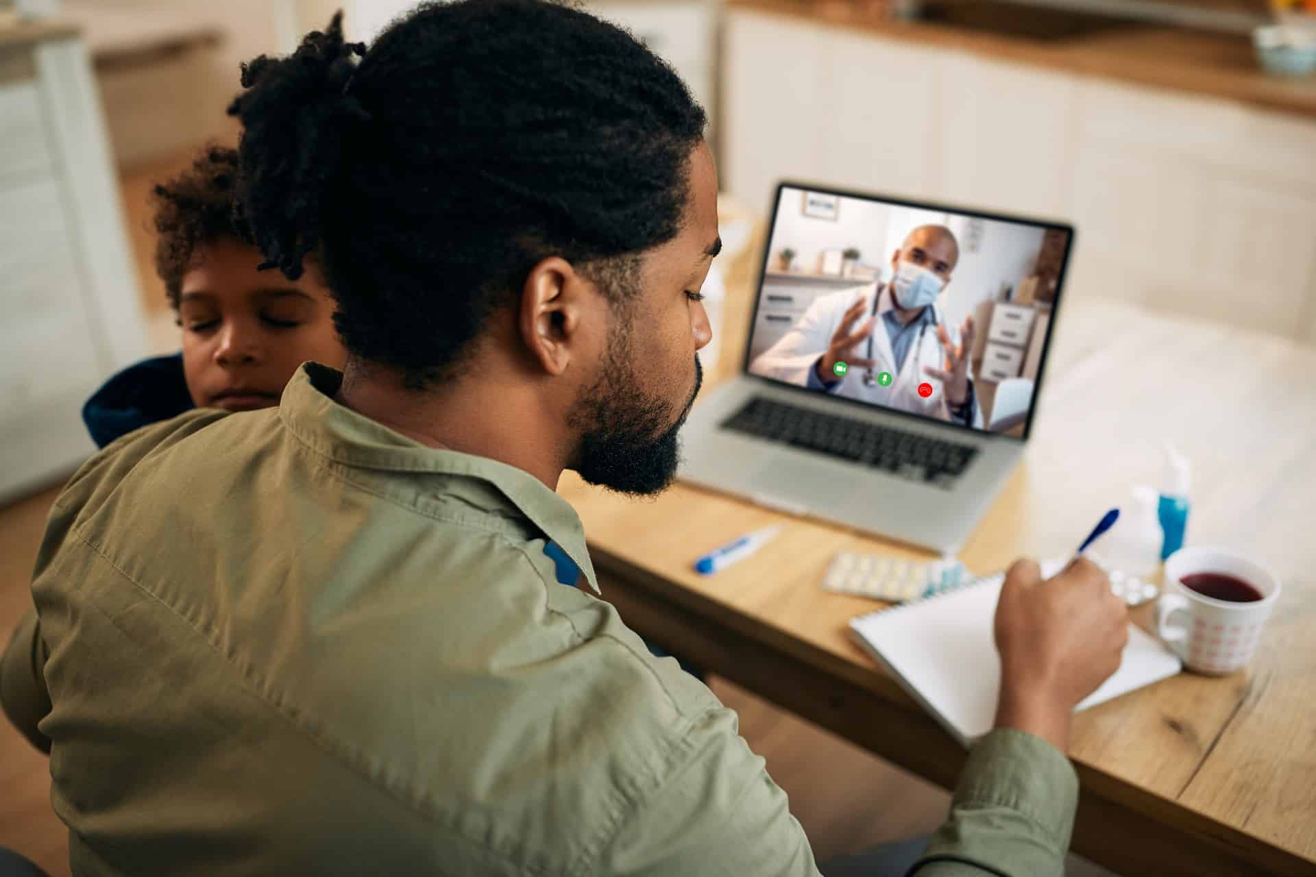 Person in a video call with a doctor | hospital negligence lawyers​ | Menzer Law|Girl in a green sweater sitting on a couch holding a tablet | personal injury law firm​ | Menzer Law|Two adults and a child sitting with a laptop | medical malpractice law firm​ | Menzer Law